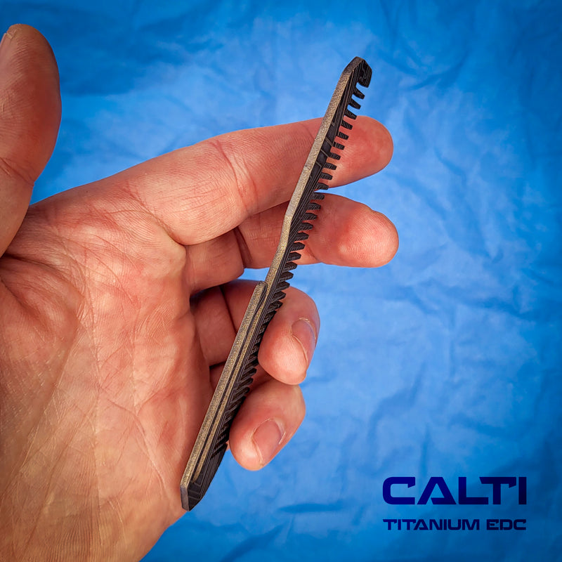 Load image into Gallery viewer, Titanium Black Comb from Calti with clip, edc tool, tactical tool, edc, every day carry, hair comd, titanium edc, tactical edc
