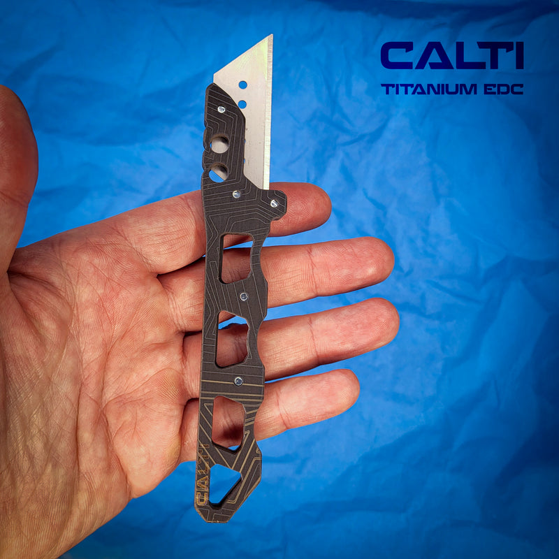 Load image into Gallery viewer, Ultimate Titanium EDC Collector’s Set – 5-Piece Tactical Gift Bundle: Utility Knife, RFID Wallet, Pocket Prybar, Hypoallergenic Cross &amp; Grooming Comb
